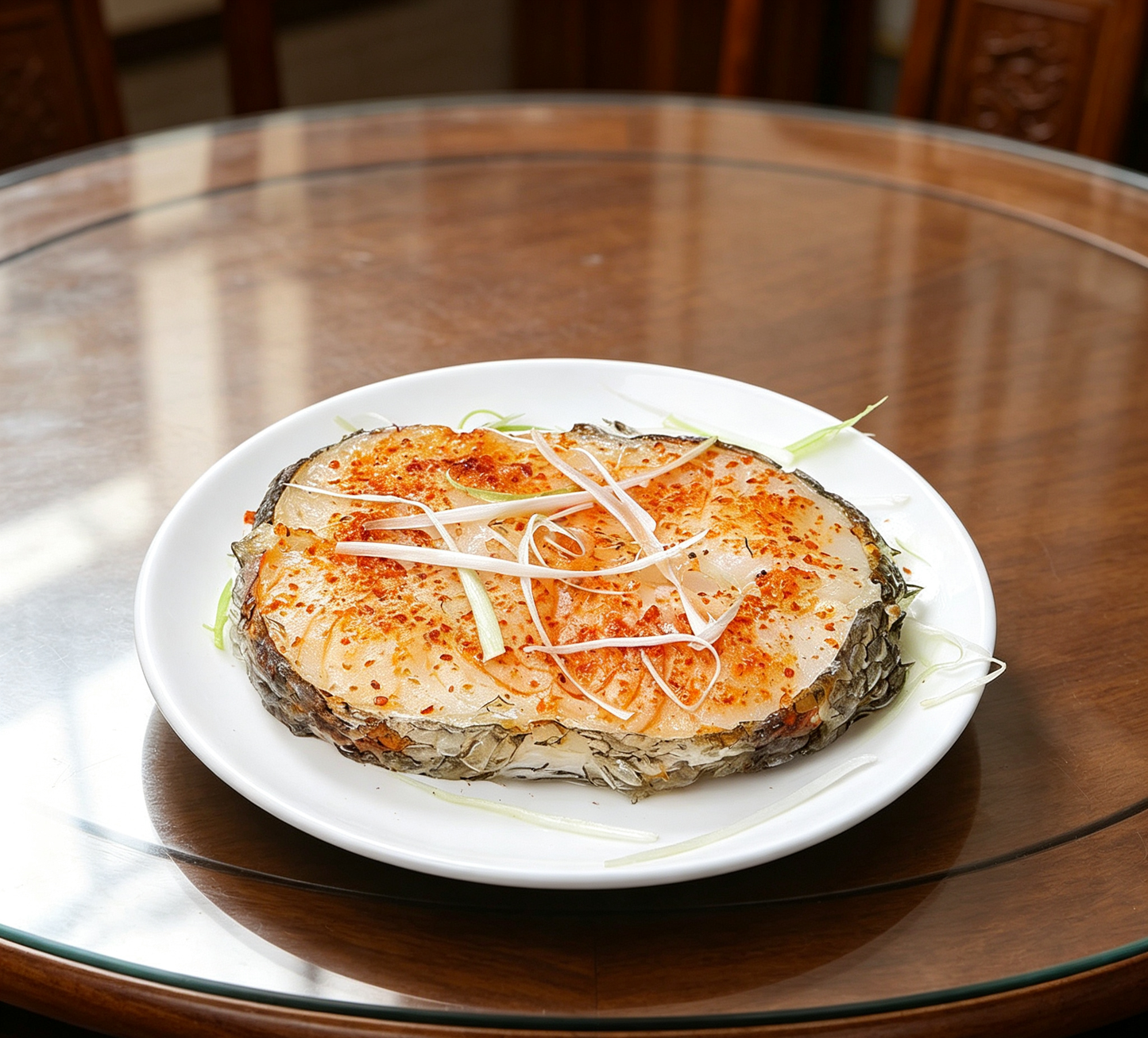 Delicious Steamed Fish Fillet with Chili and Ginger Garnish